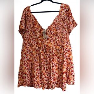 Torrid Babydoll Smocked Back Puff Sleeve Top in a floral print.
